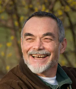 Older smiling man, outdoors